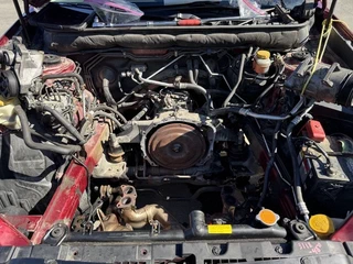 The bay stripped down, looking at the bellhousing with the engine out