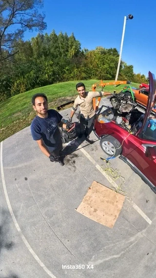 Lifting the old engine out with the hoist