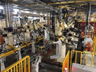 Row of spot-welding robots on the line