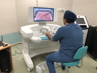 Surgeon practicing laparoscopic procedures on the robot